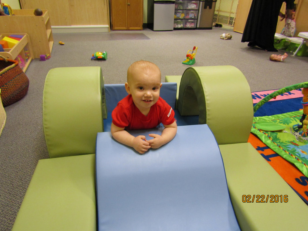 Baby exploring a soft play structure